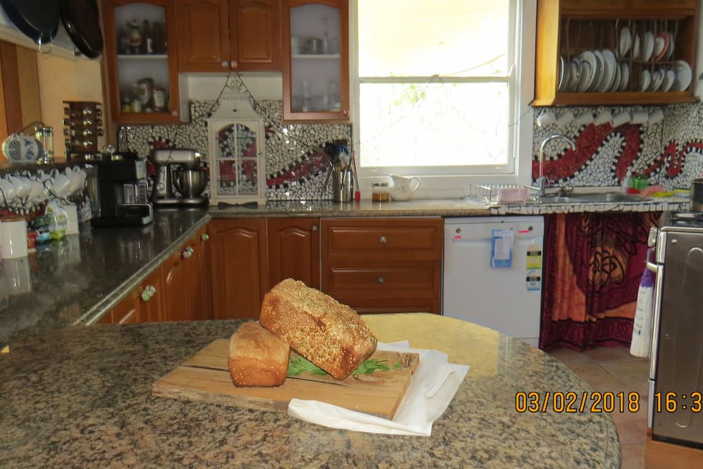 Full kitchen with Coffee machine and loaf of fresh bread on arrival