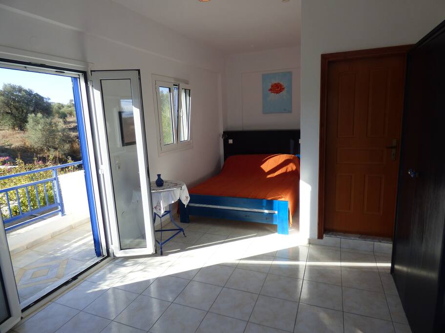 Bedroom with doors to private balcony