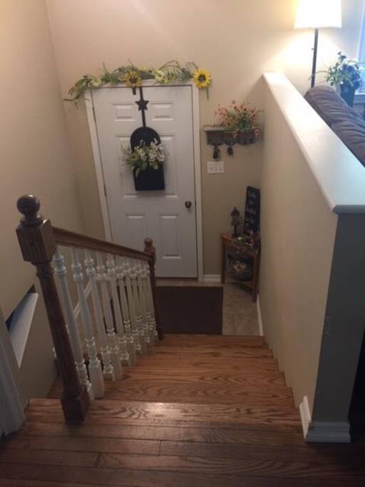 Looking down to the front door from the living room