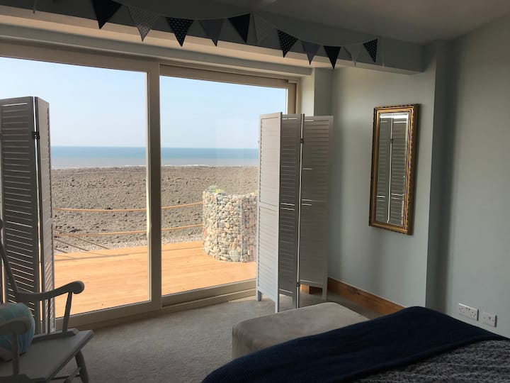 Access outside via the main bedrooms sliding doors.