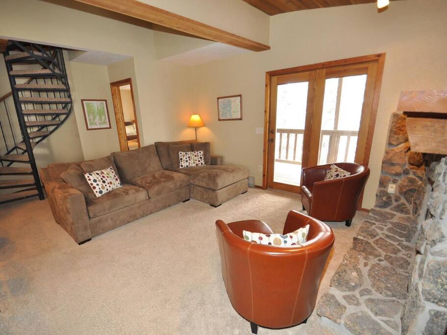 Living room with walk out patio overlooking Vazquez Creek.