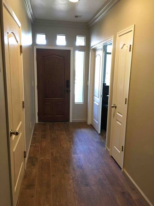 Entrance to the guest area to the left of as you enter the front door.