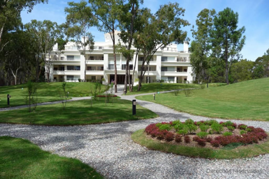 Unique Litman Architects design with professional landscaping throughout complex.