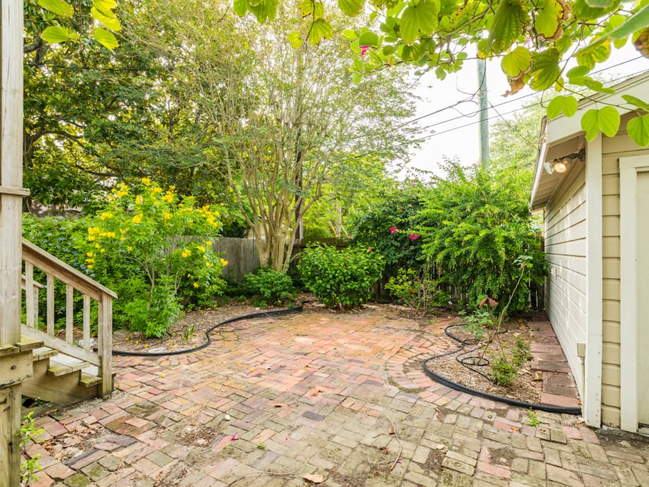 The brick covered rear yard offers plenty of room for fun while you cook out or enjoy the night breeze.