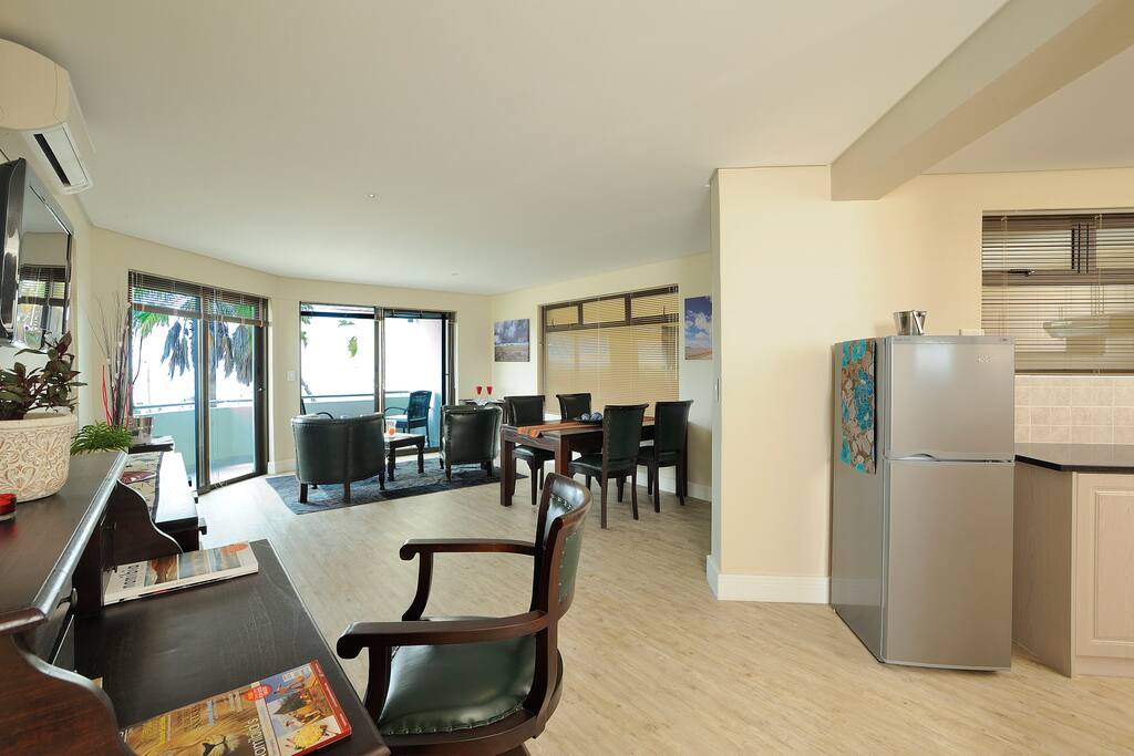Lounge with open kitchen and balcony