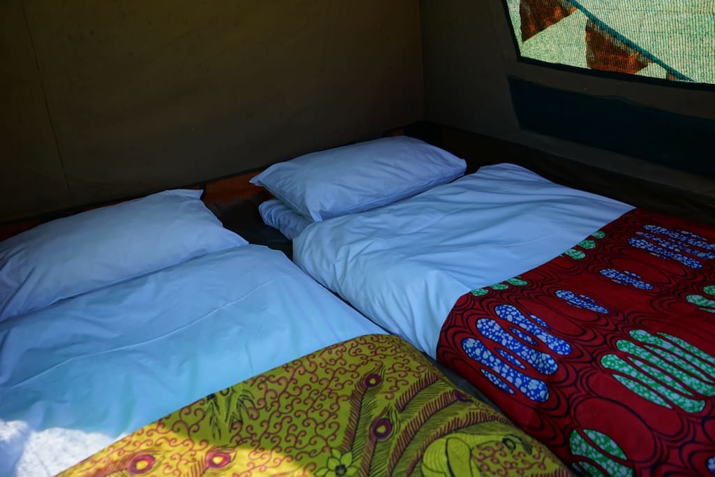 2 people can sleep in each tent, or one person