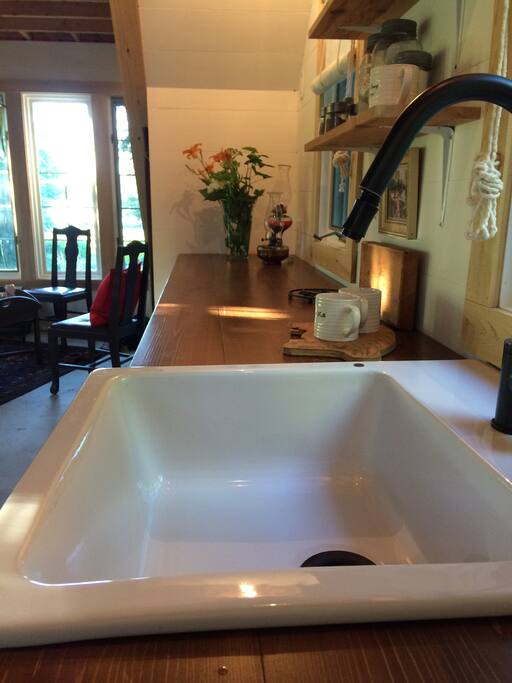 The kitchen sink and counter where you will find a few things to get you going in the morning..