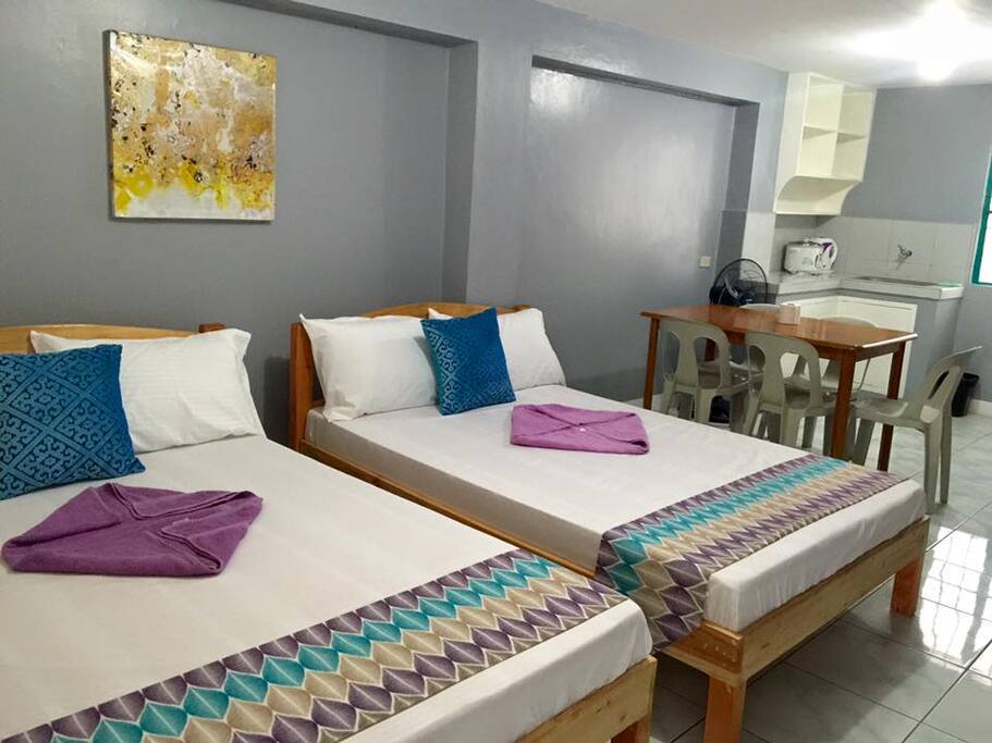 first floor - 2 double beds, dining area, tv and private bath. kitchen with rice cooker and water boiler and sink