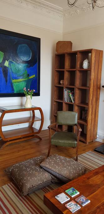 Bookshelf with books of Scotland and tourist and Fringe Festival information.