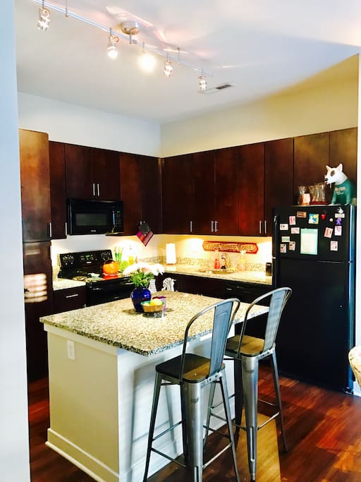 Eat in kitchen with granite countertops.