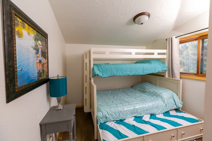 Bedroom with a bunkbed (twin, full) and trundle bed.