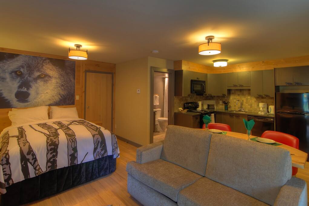 Drift to sleep in the Mountain Luxury queen-sized bed after a day exploring the Rockies.
