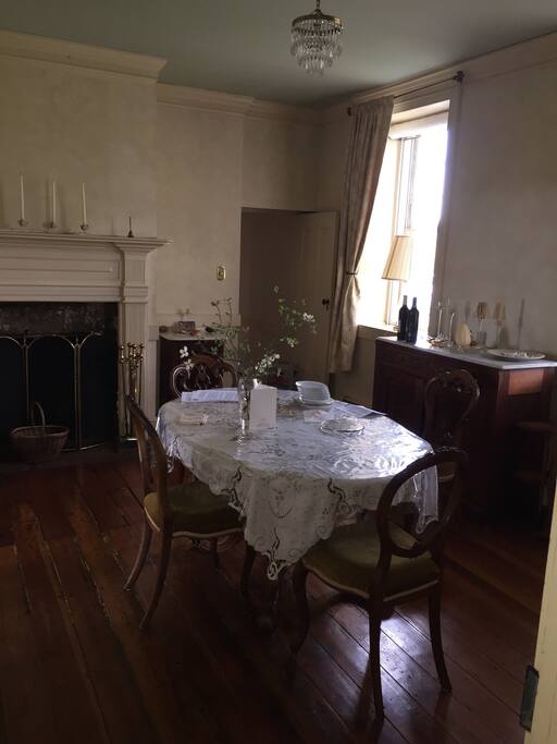 Dining room from the other side of the room with kitchen door in back of room.
