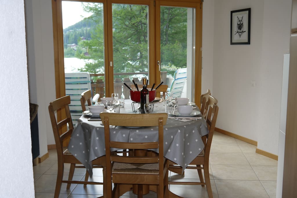 Dining area with separate balcony overlooking lake