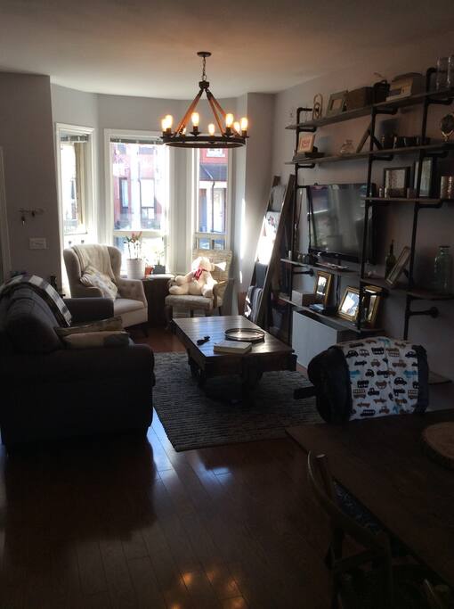 Living room with full couch and 2 large chairs.