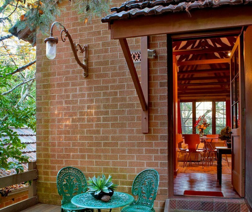 The deck area leading into the cottage. A tranquil spot to read and listen to the birds! The space surrounding the raised deck is fenced for dogs.