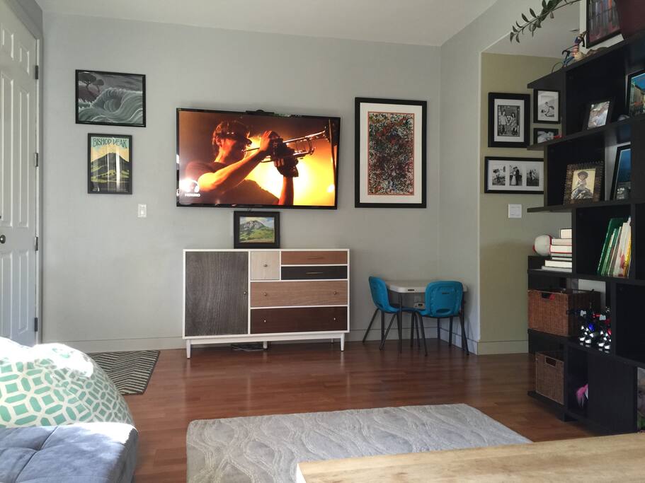 Living room with large flat screen TV.
