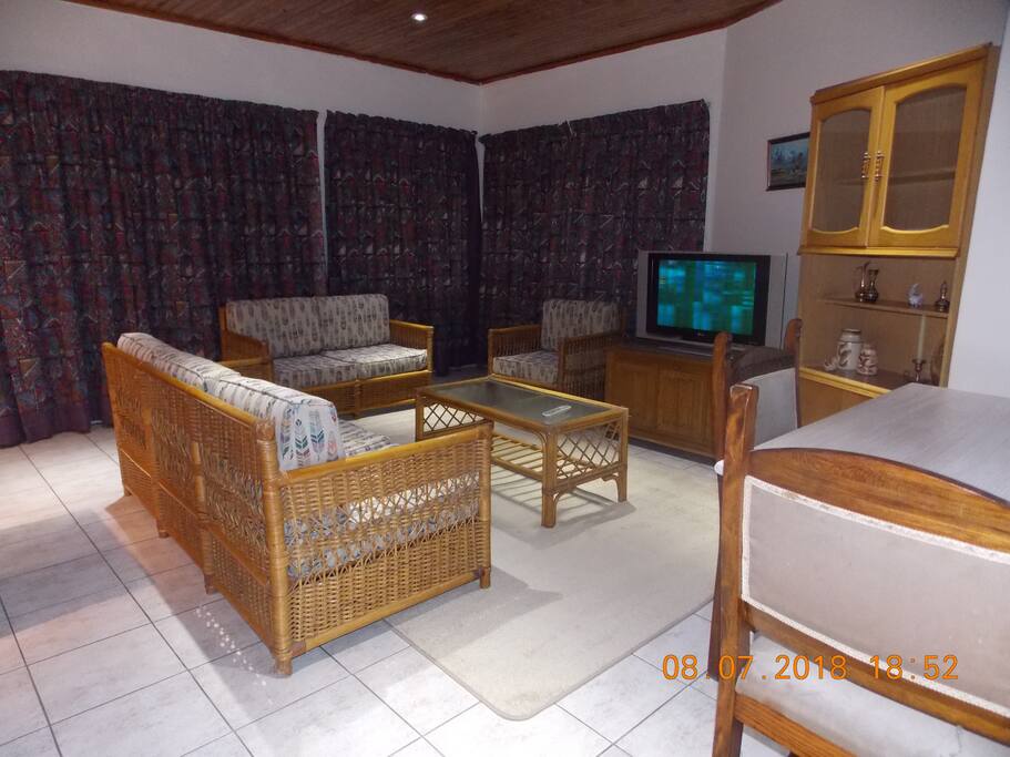 Open plan lounge/tv room.
