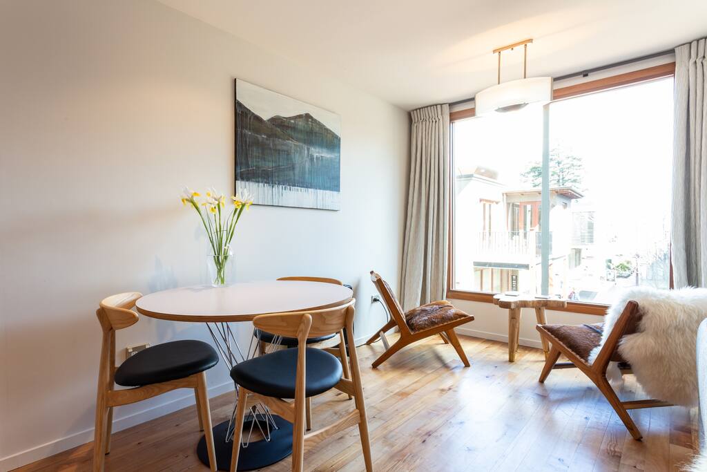 The living room has huge windows that flood the area with loads of natural light.