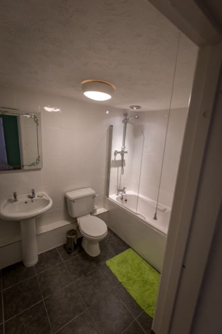 Ensuite bathroom with bath and shower