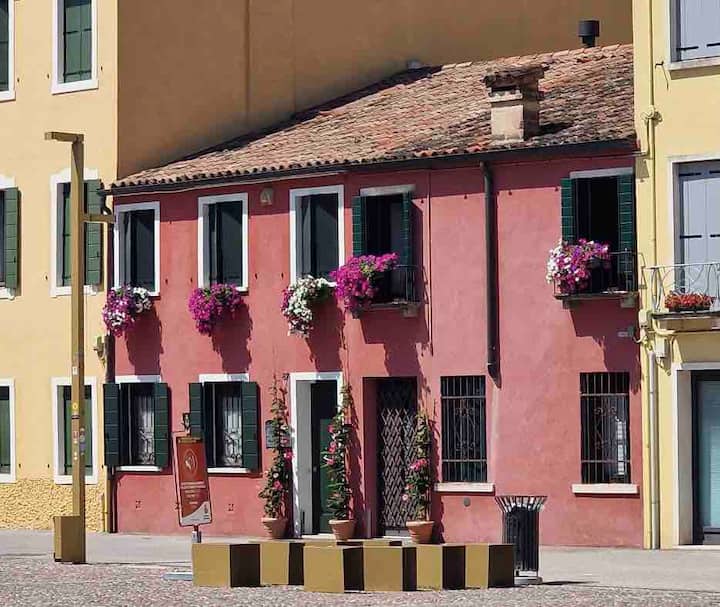 Historic property in front of Piazza in "Borgo Portello"