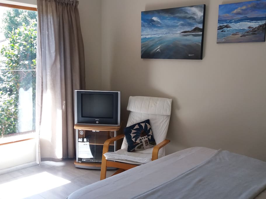 tv and double bed in bedroom 1
