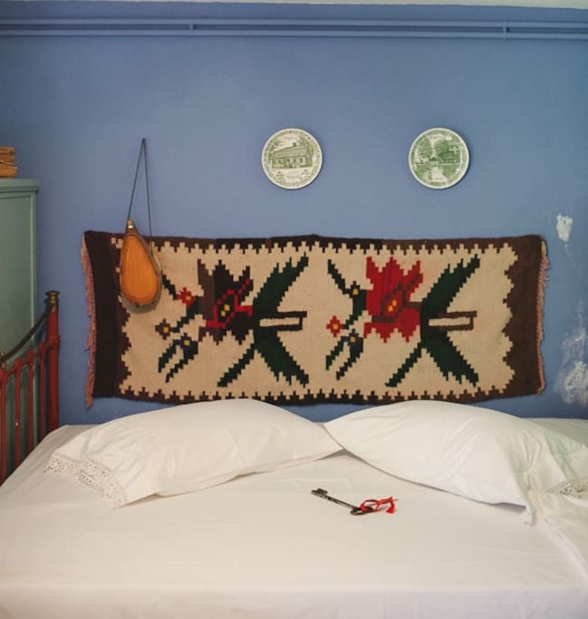 The double bed in the basement room