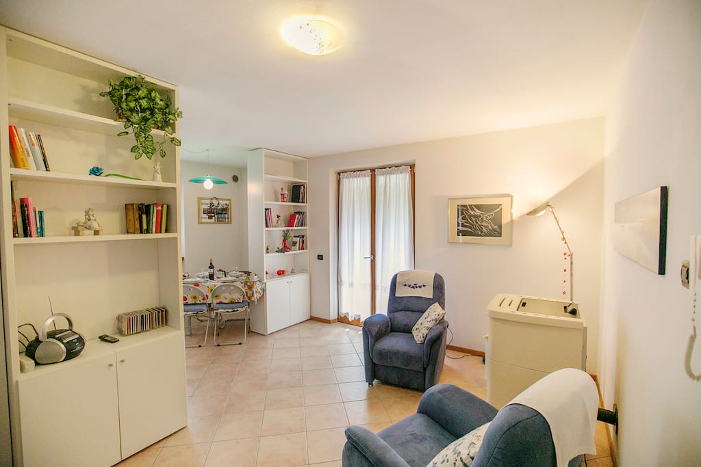 The bright living room with exit to the terrace