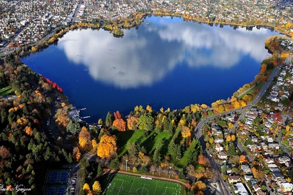 We are located right in the middle of the right side of this photo of Seattle's beautiful Green Lake neighborhood. At the top-right is Green Lake's commercial district with lots of cafes and restaurants. At the bottom of the photo is the 9-iron community golf course and forested Woodland Park.