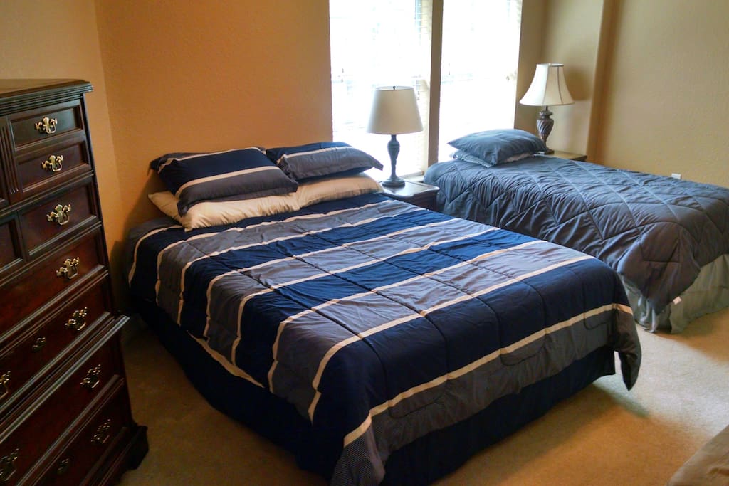 Comfy beds, ample dresser space, a large closet, and a separate bathroom make this private room feel like home.