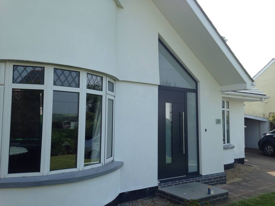 Modern front door with porch. Large cupboard for boots and coats