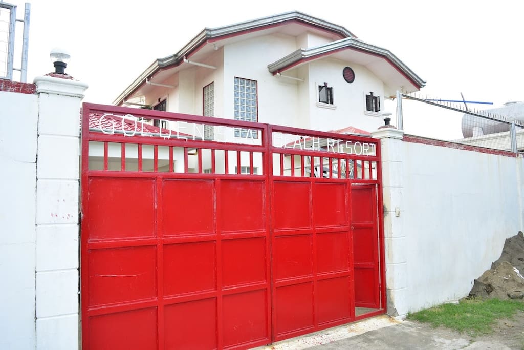 High fence & gate with the name of the resort...