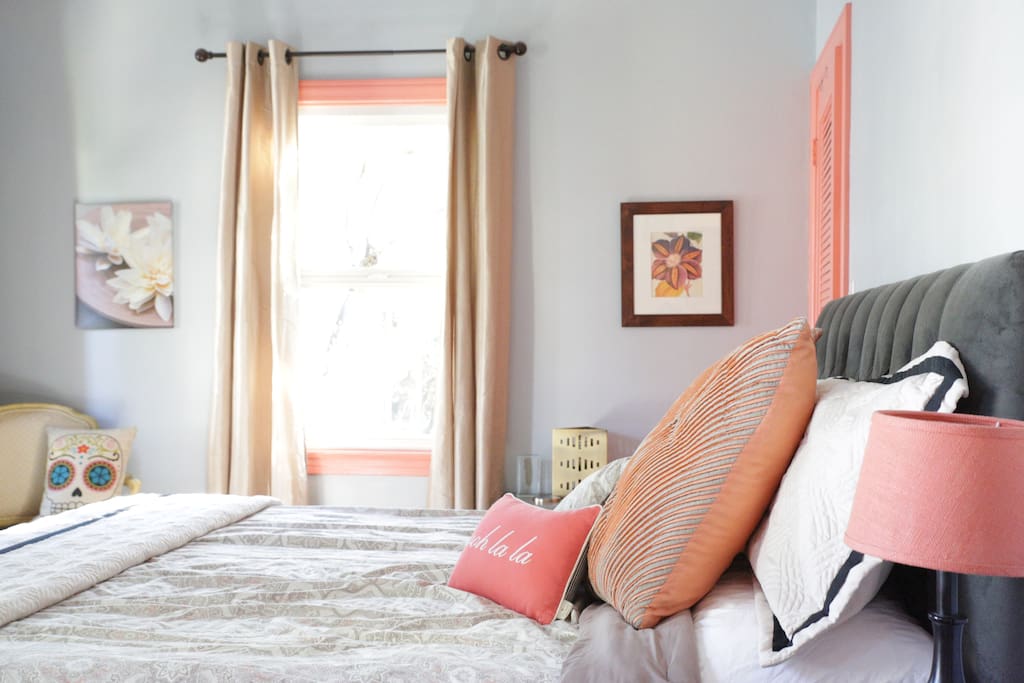 Glamorous master bedroom with California king bed