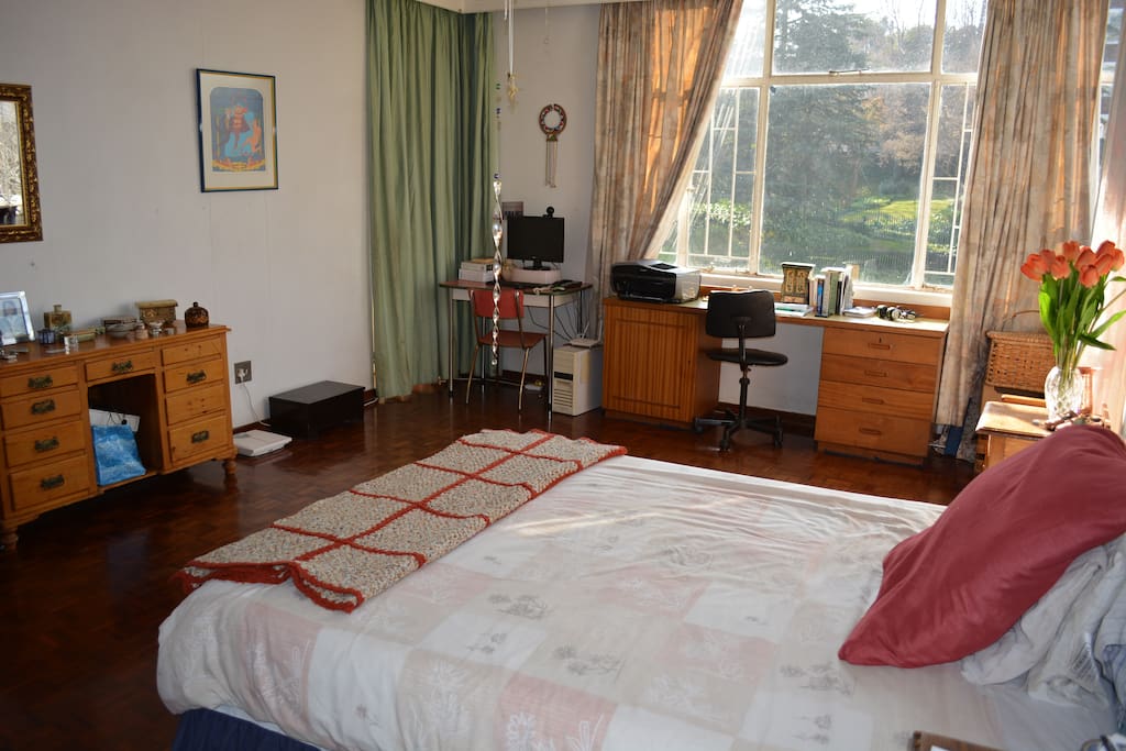 Sunny master bedroom in upscale neighborhood