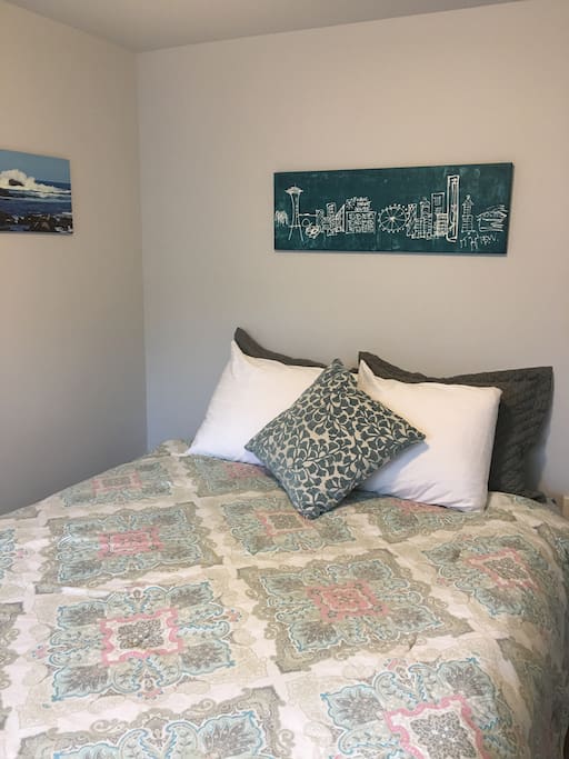 Queen size bed with 600 thread count linens. Bed is able to be entered from both sides and looks out over the patio.