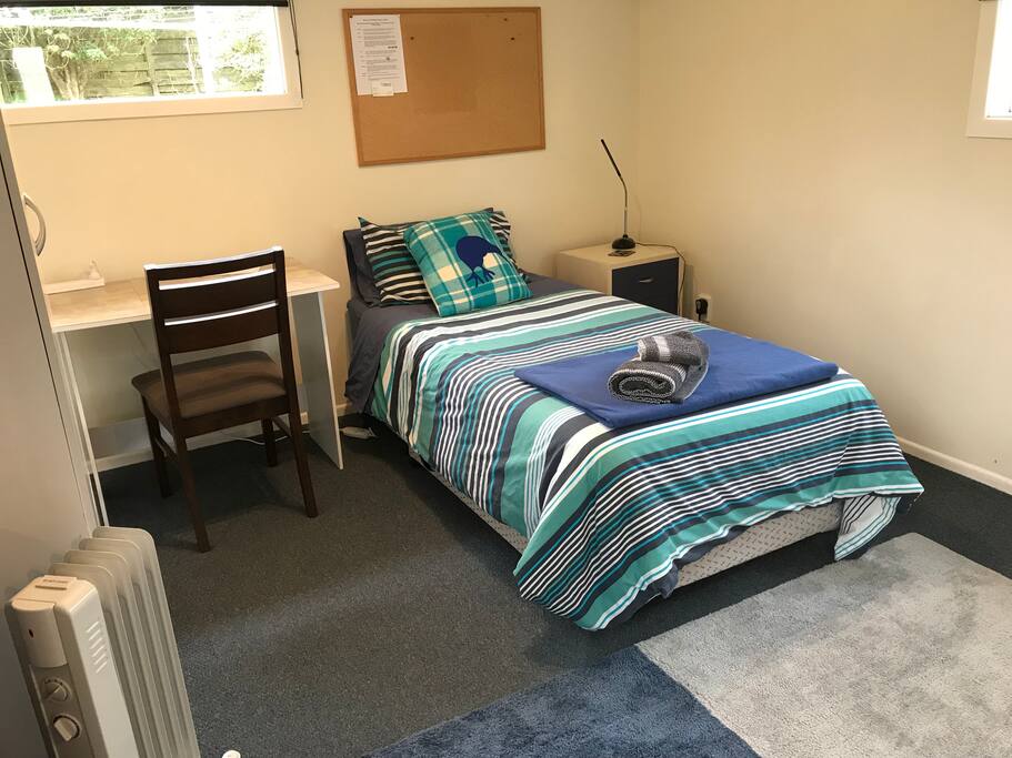 One of the two comfortable single beds with plenty of space for both beds in the room