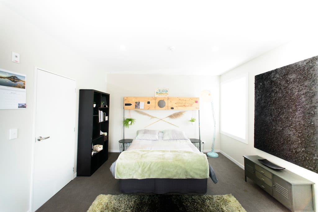 Comfy queen bed and 'Silence' artwork by Eugenia Zeiser.