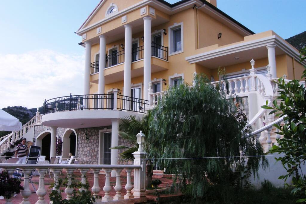 Front side of property, which is the same level as the pool.
