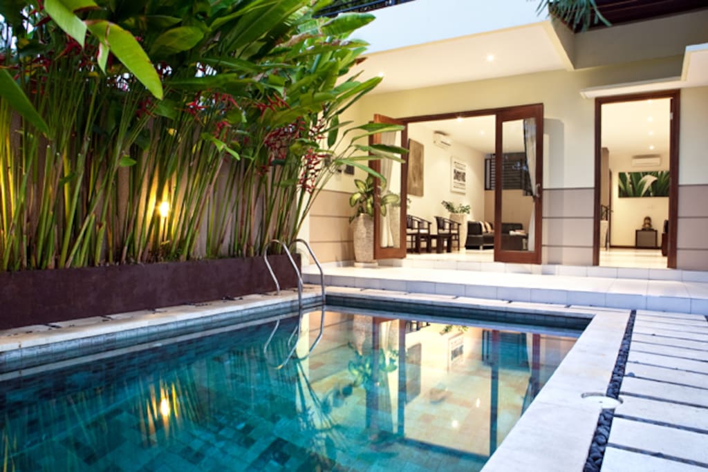 Outside by the pool area, doors can be open or closed.