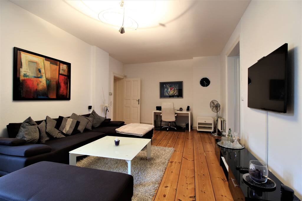 The huge couch is ideal for relaxation after a busy day in the city.