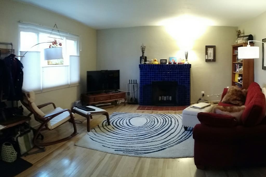 Sunny, west facing living room with working fireplace