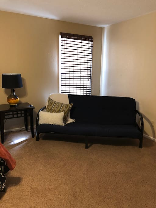 Futon in bedroom, could serve as another bed