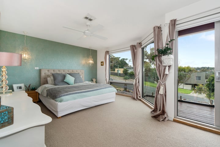 Master bedroom with views overlooking the Mt Martha Lifesaving club. Watch the energetic swimmers from bed or the storms come in over the Bay