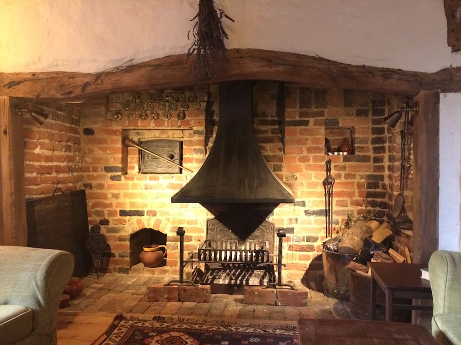 Living room: cosy seating in front of original inglenook and breadoven