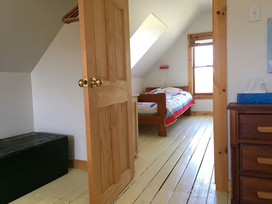 There are extra pillows and blankets in the wooden chest. There is a single bed in the outer room for an extra grownup or child.