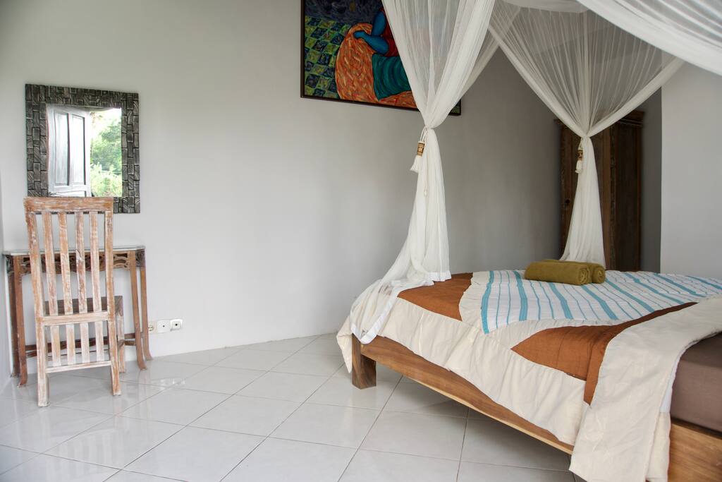 Simple and bright room with fan and private bathroom