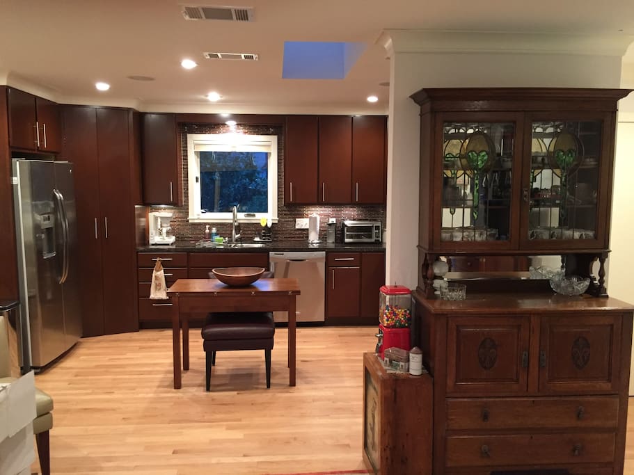 Open concept kitchen w/skylight. Chef's kitchen w/stainless appliances & granite counters.