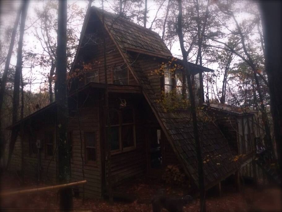 tucked in the woods over a waterfall an A frame cedar retreat