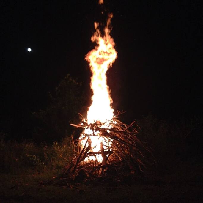 Outdoor wood fire by the pool.
