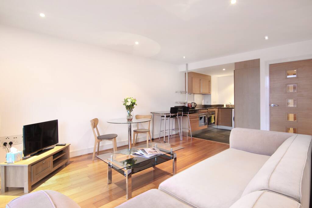 The new sofa looking towards the TV, dining table, breakfast bar and kitchen
